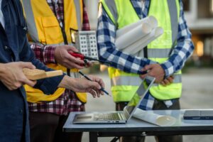 City works employees discuss a public works project on-site