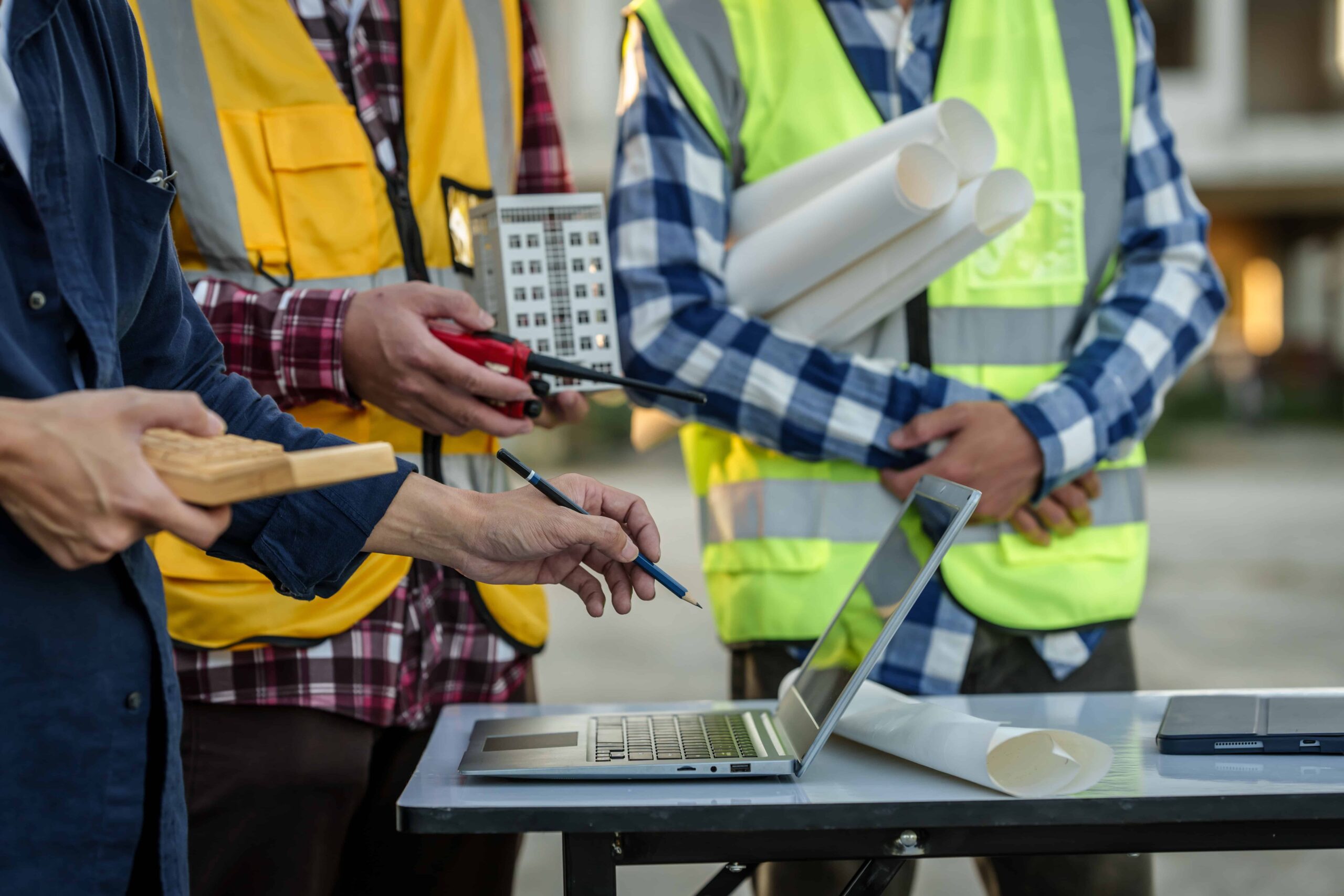 City works employees discuss a public works project on-site