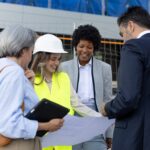 Architects discussing plans at a construction site