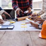 Architects and engineers having a meeting on a construction site