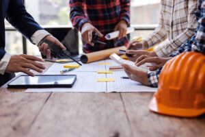Architects and engineers having a meeting on a construction site